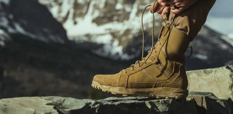 Man Tying tactictal boot shoelace