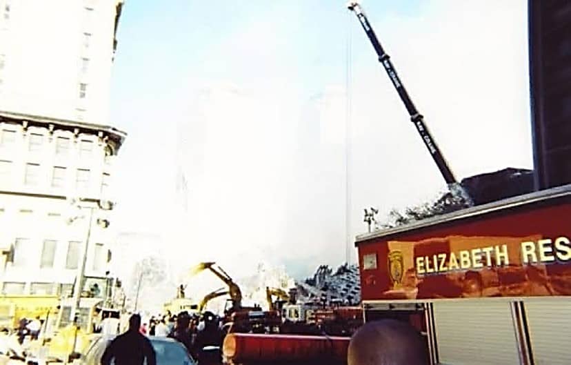 Emergency crews and heavy equipment working near Ground Zero during 9/11 rescue and recovery efforts
