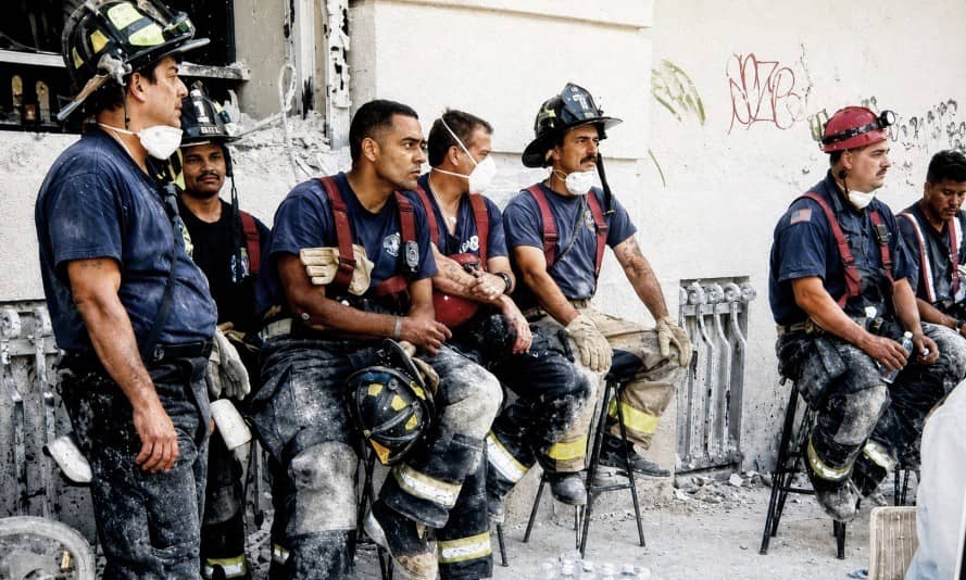 Firefighters taking a break during 9/11 rescue efforts at Ground Zero