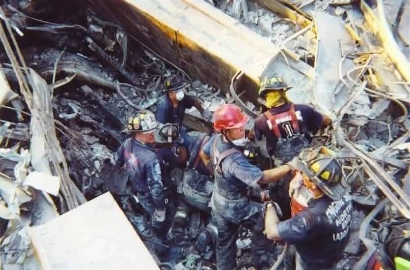 Firefighters conducting rescue efforts at Ground Zero after 9/11