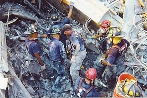 Firefighters searching rubble at Ground Zero after 9/11
