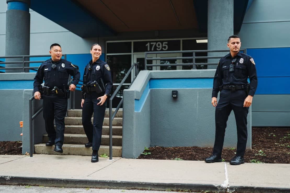 Police officers exiting building