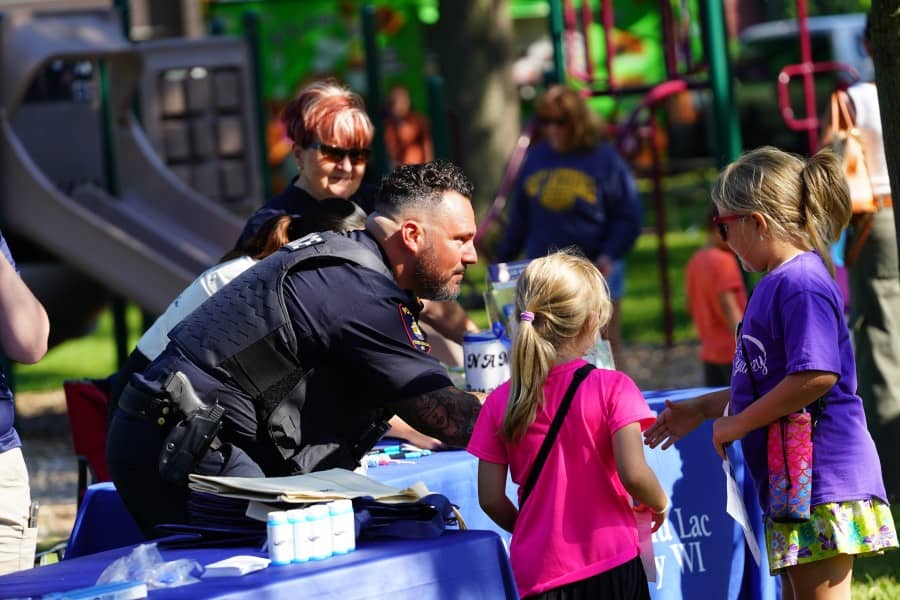 Police officer children community outreach event