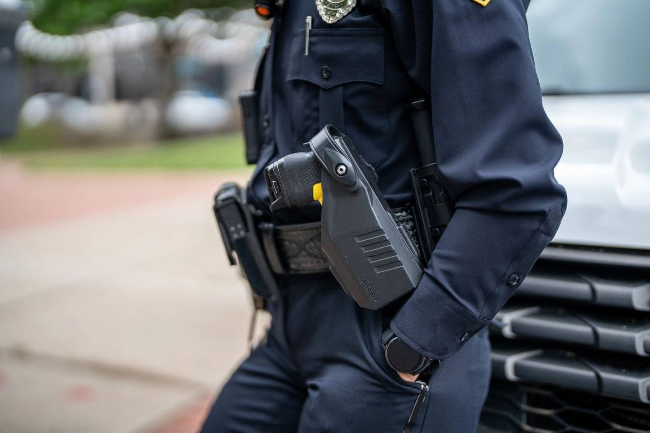 Police officer wearing duty belt with taser holster