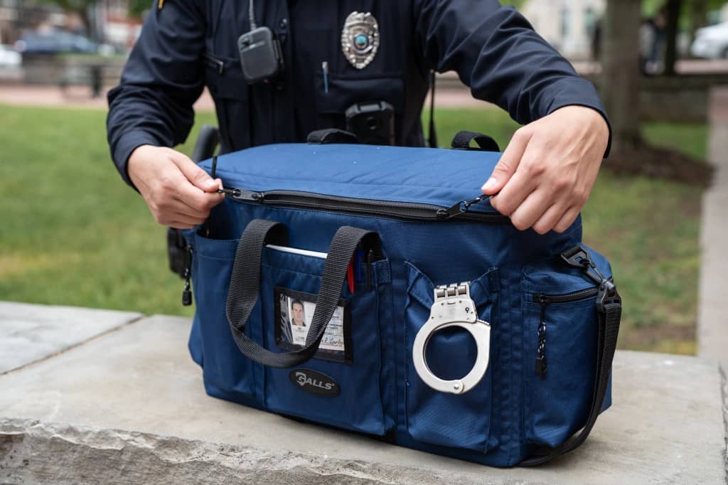 Police officer opening Galls duty bag