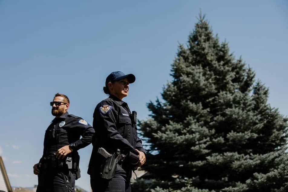 Police officers standing opposite outdoors