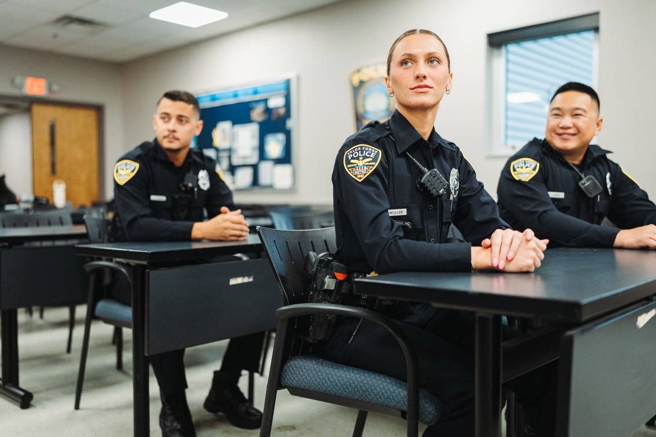 Police officers sitting in classroom